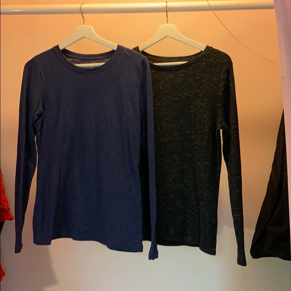 Two long sleeved crew neck t-shirts